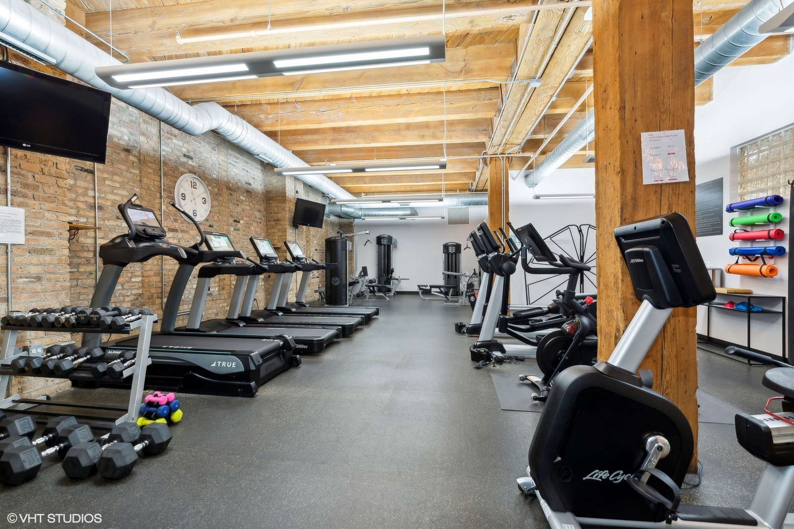 1040 West Adams Street, Unit 473 Chicago, IL 60607 - Photo 18 of 19 a view of a room with gym equipment