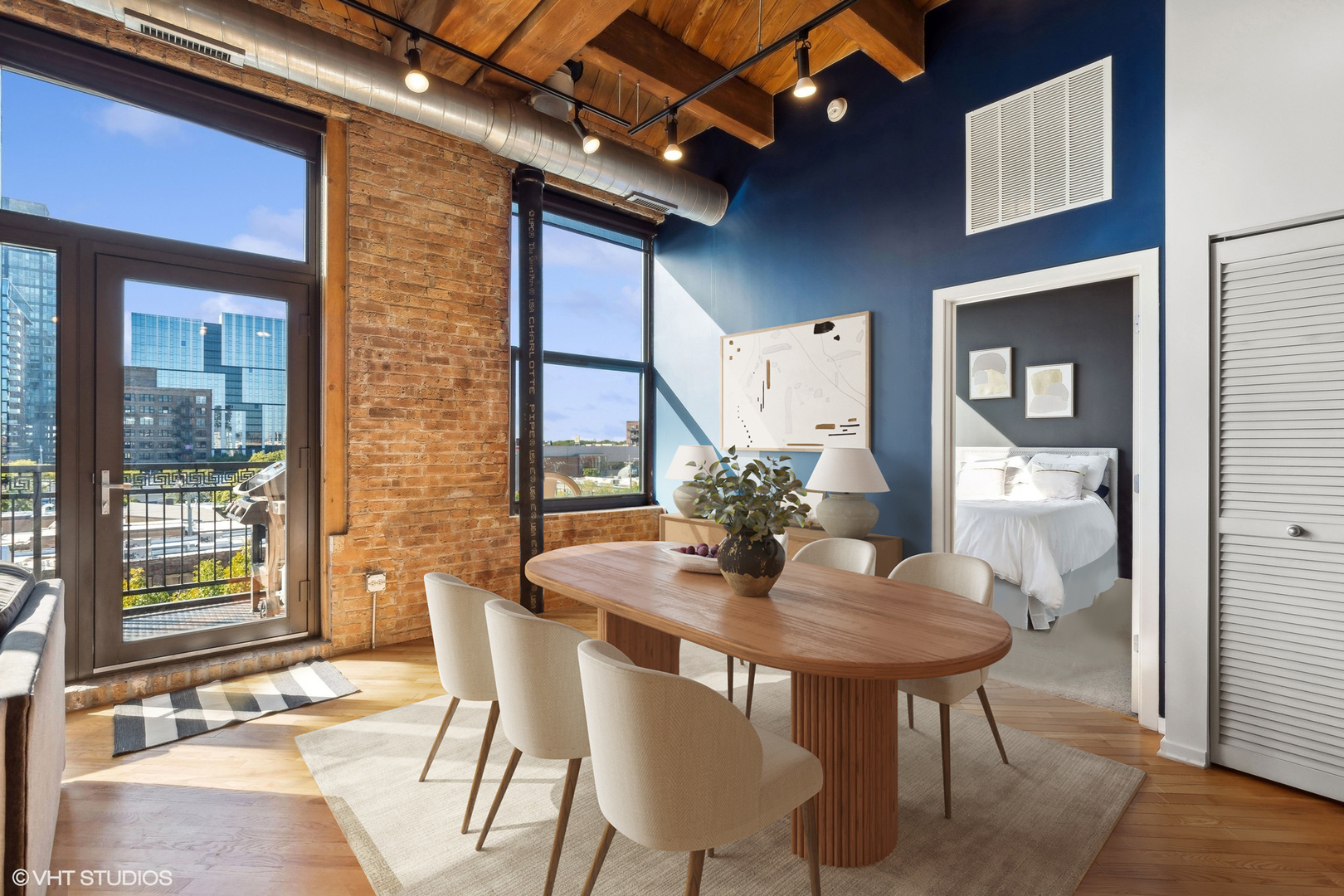 1040 West Adams Street, Unit 473 Chicago, IL 60607 - Photo 4 of 19 a dining room with furniture and wooden floor