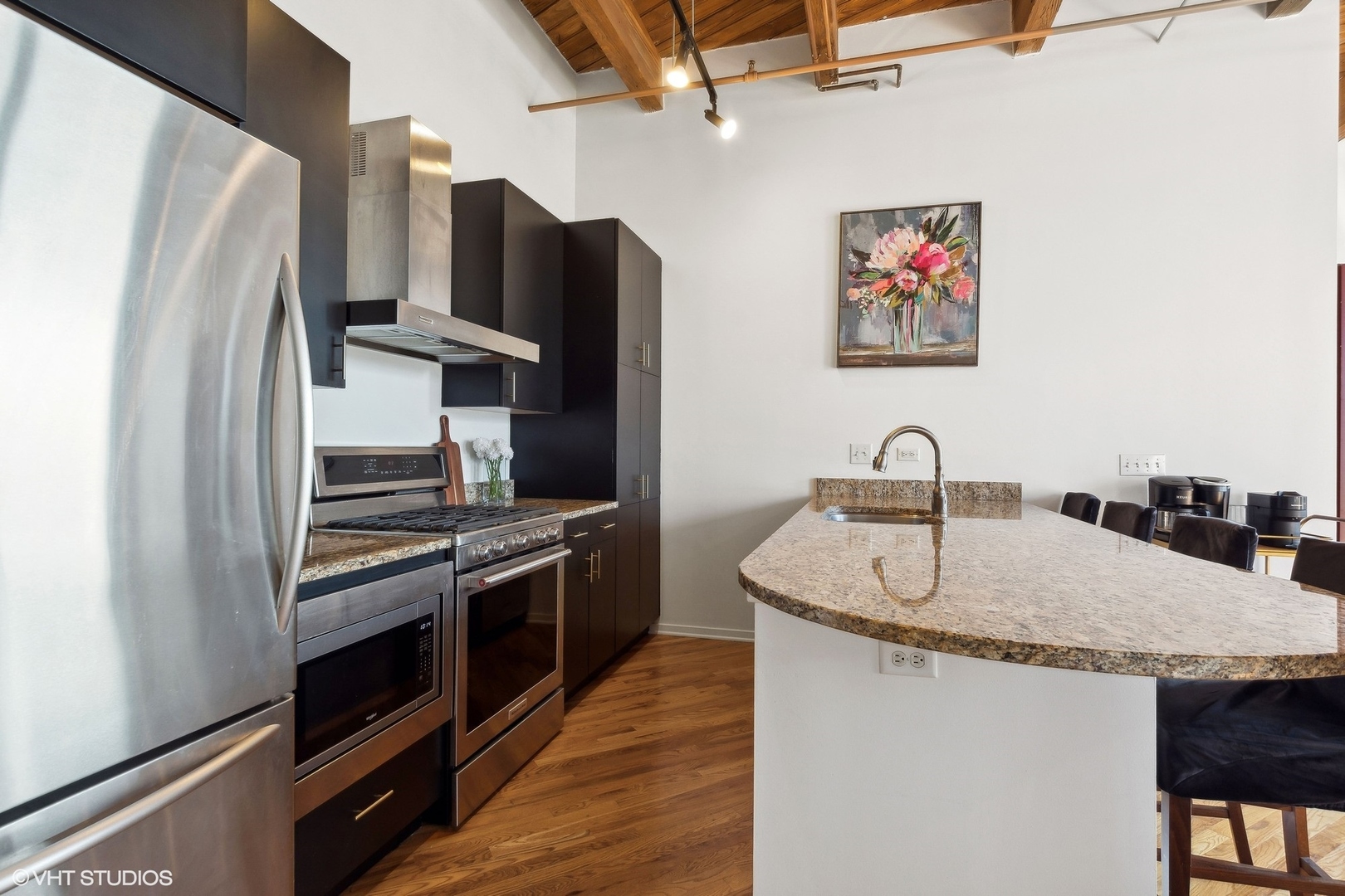 1040 West Adams Street, Unit 473 Chicago, IL 60607 - Photo 8 of 19 a kitchen with stainless steel appliances granite countertop a refrigerator and a sink