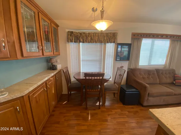 a view of a livingroom with furniture and window