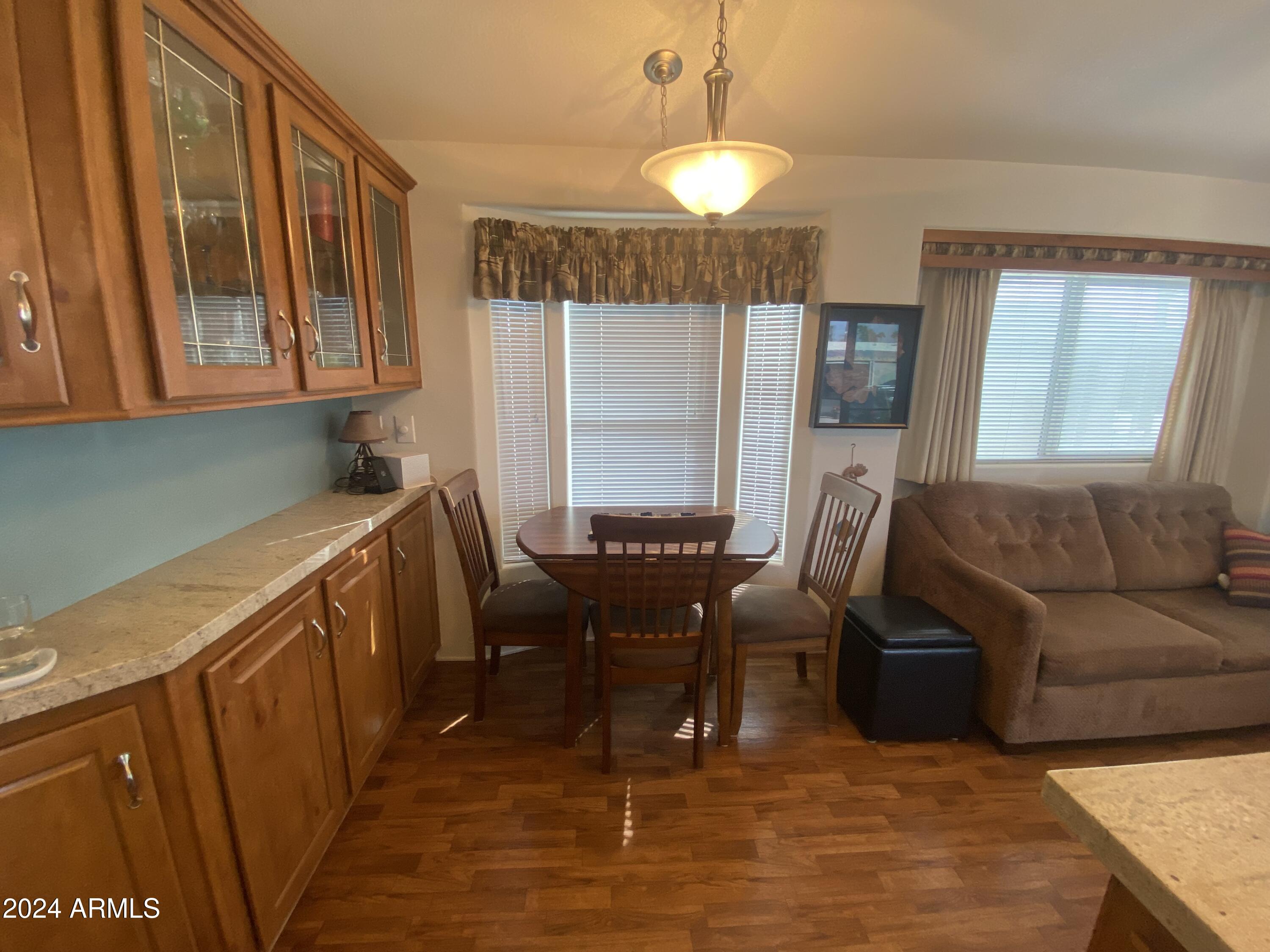 1415 South Havasupai Drive, Unit 415 Apache Junction, AZ 85119 - Photo 14 of 28 a view of a livingroom with furniture and window