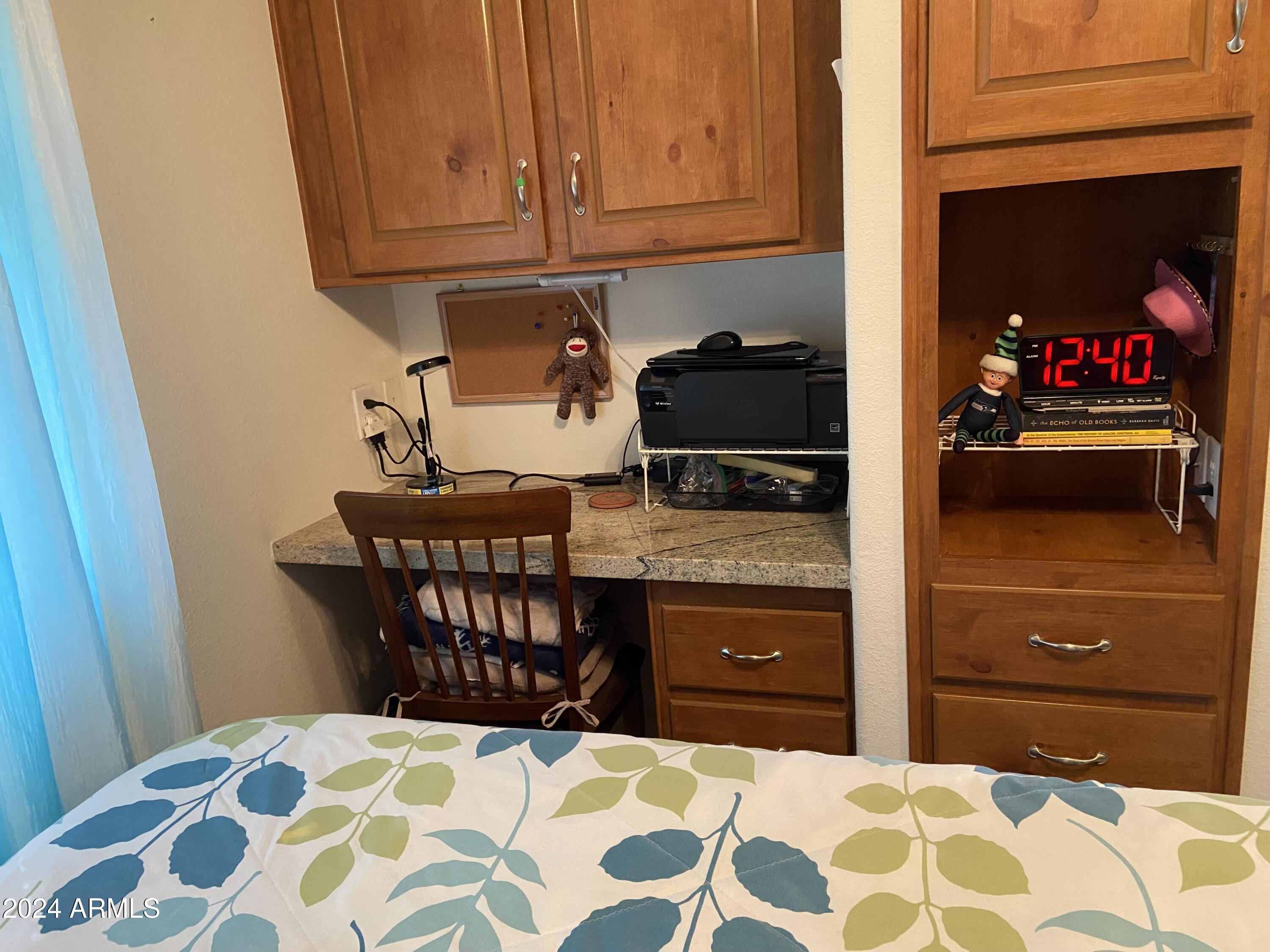 1415 South Havasupai Drive, Unit 415 Apache Junction, AZ 85119 - Photo 18 of 28 a kitchen with a sink and cabinets