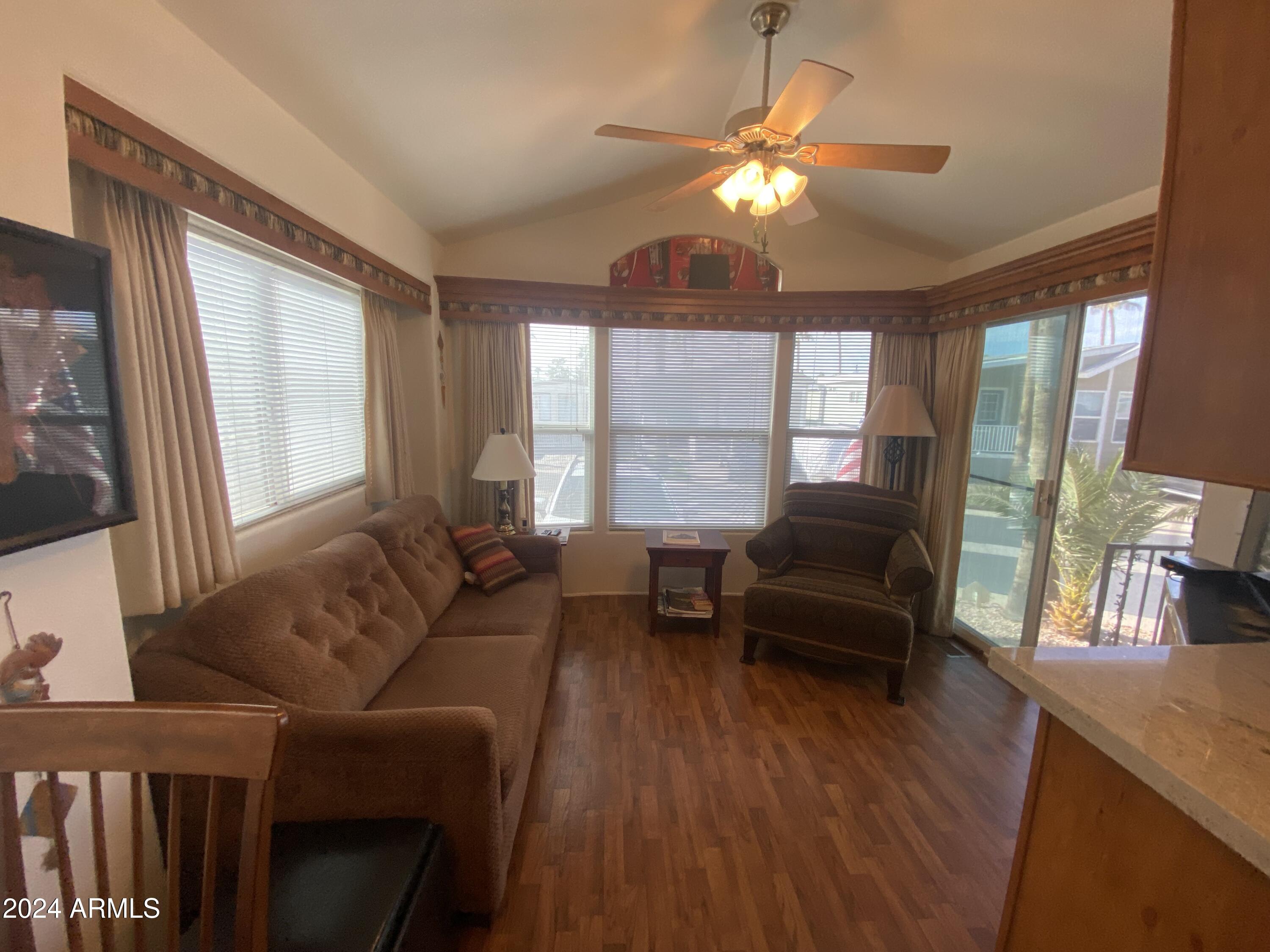 1415 South Havasupai Drive, Unit 415 Apache Junction, AZ 85119 - Photo 2 of 28 a living room with furniture and a large window
