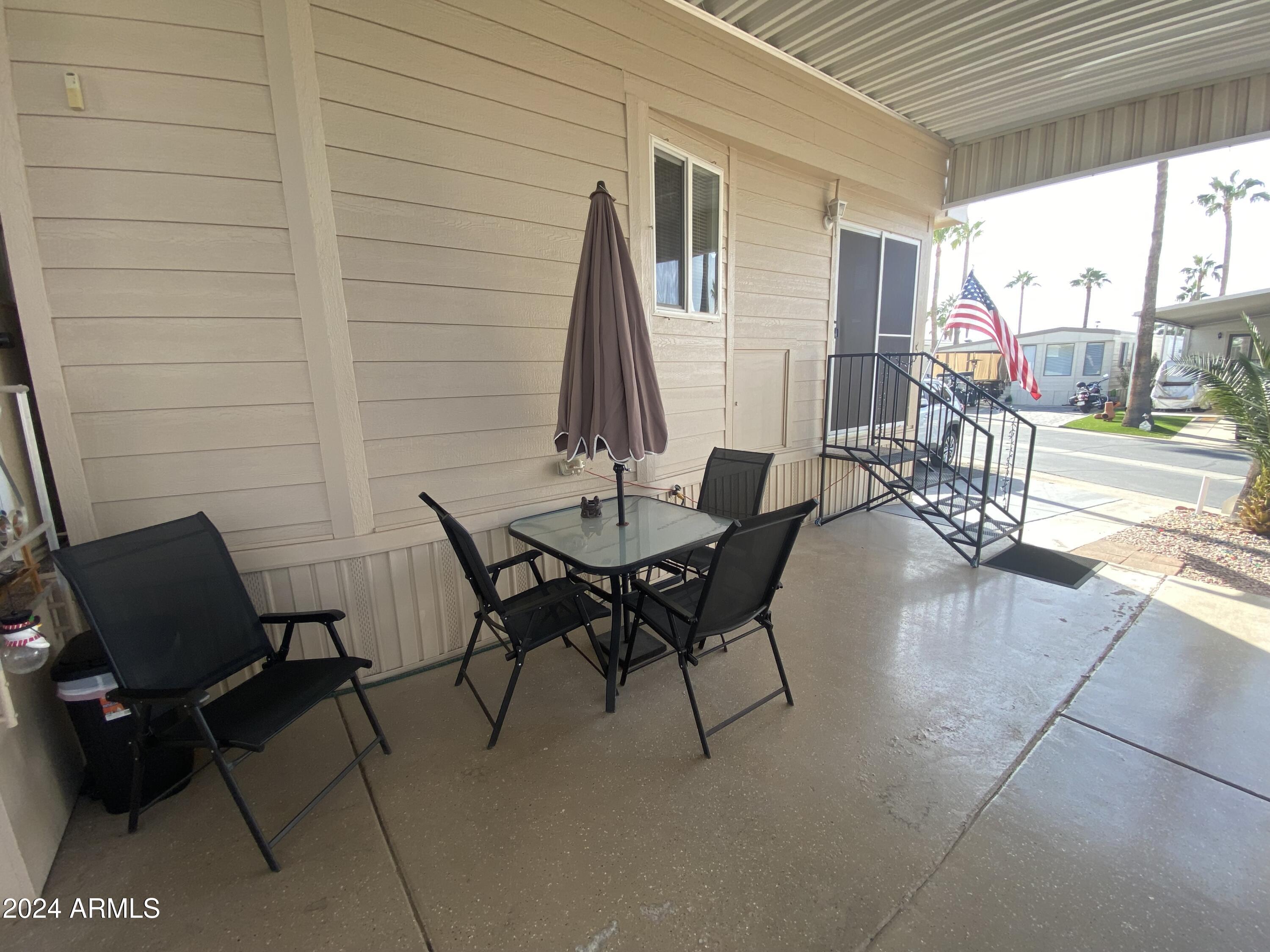 1415 South Havasupai Drive, Unit 415 Apache Junction, AZ 85119 - Photo 25 of 28 a outdoor space with furniture