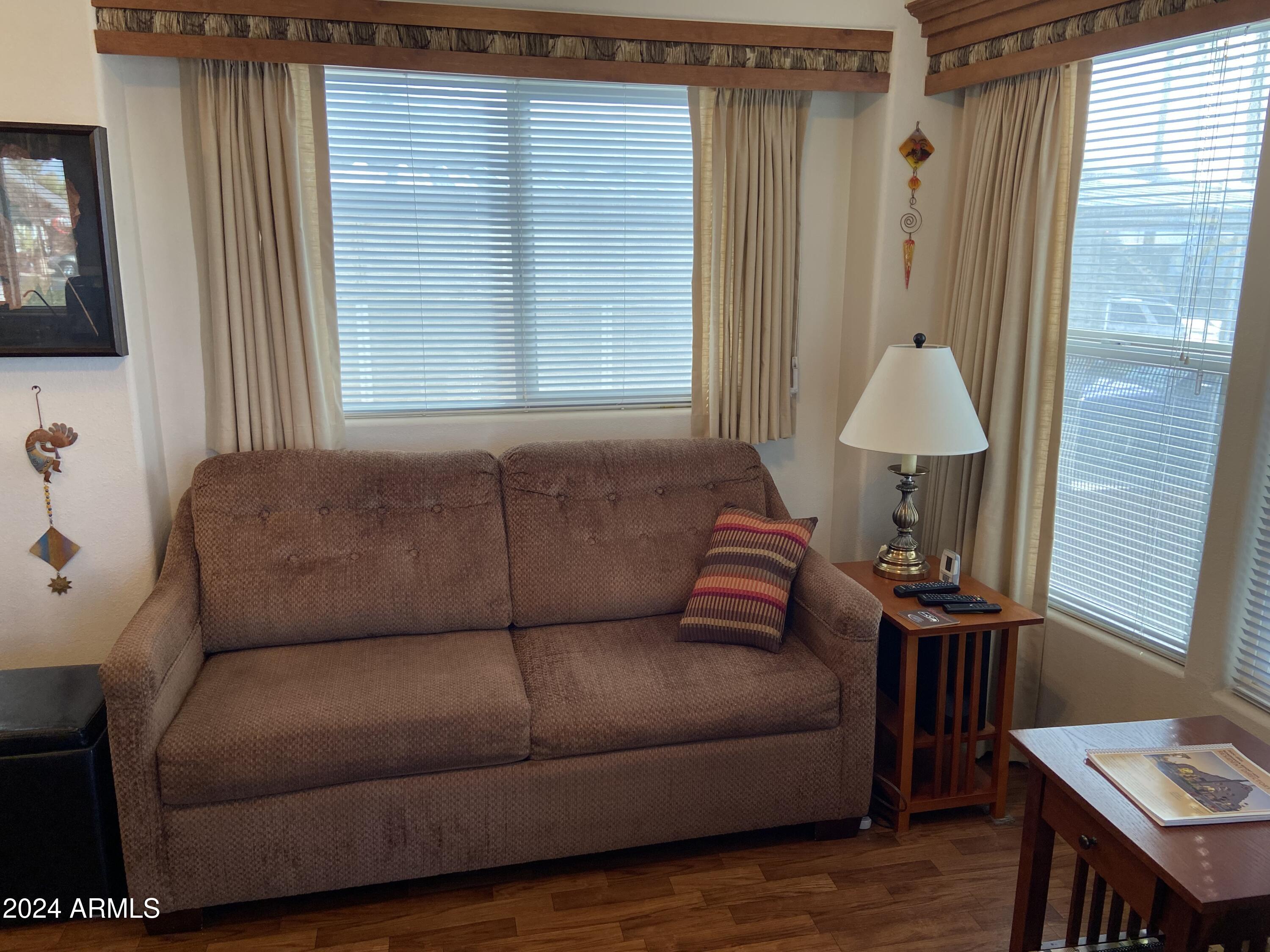 1415 South Havasupai Drive, Unit 415 Apache Junction, AZ 85119 - Photo 4 of 28 a living room with furniture and a window