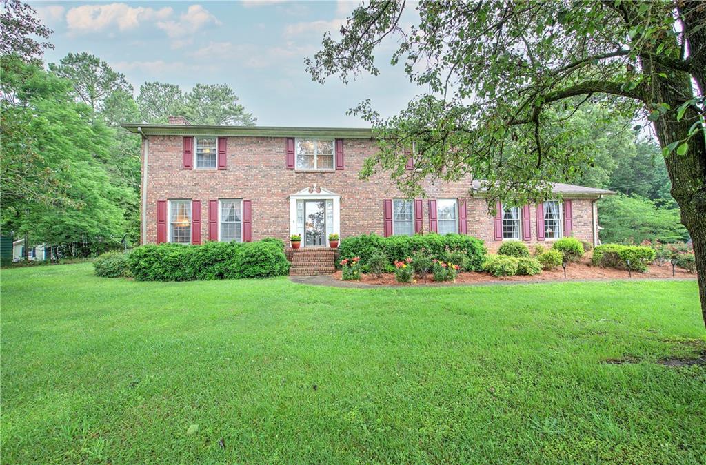 3637 Nebo Road Hiram, GA 30141 - Photo 2 of 63 a front view of a house with a yard and green space