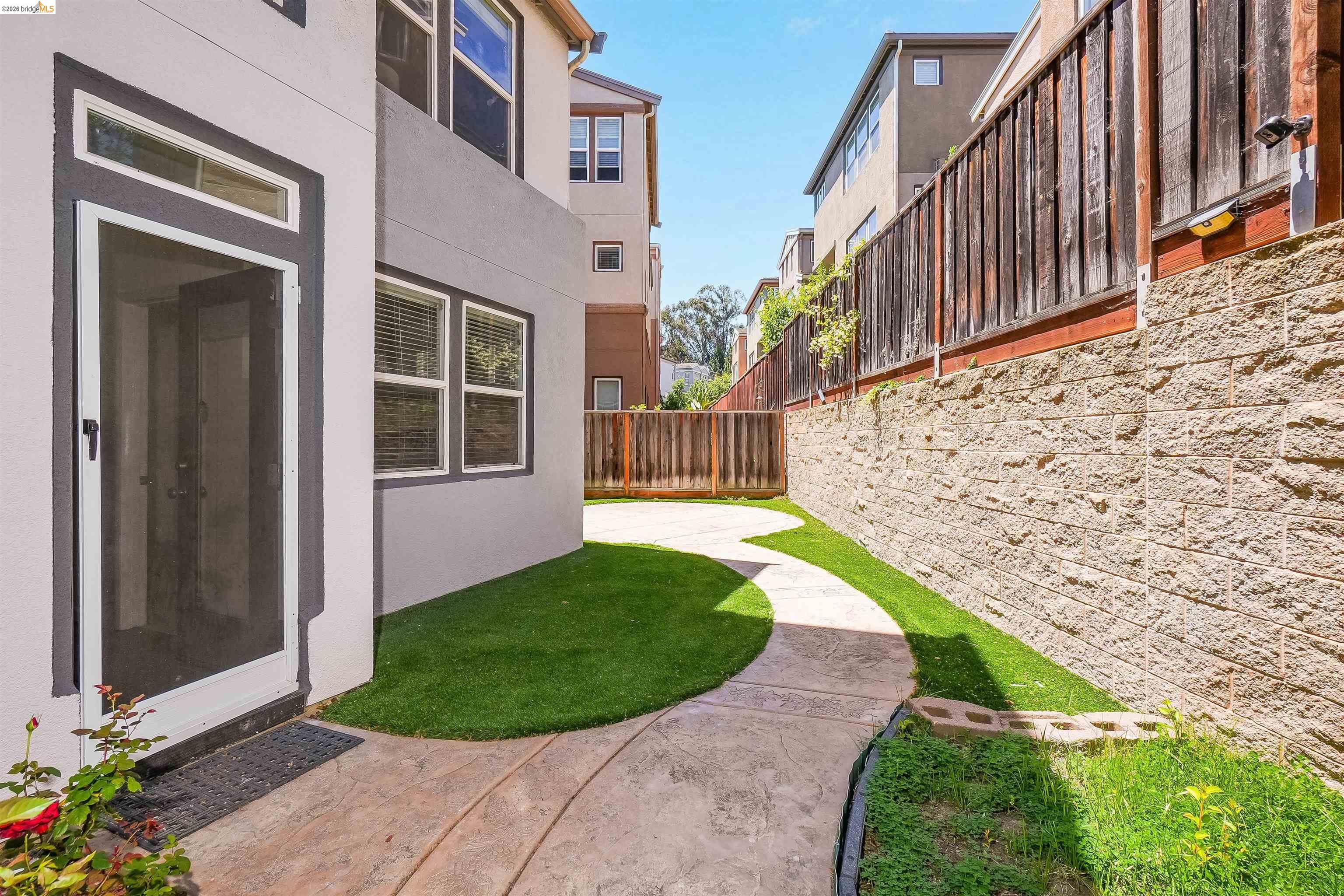 449 Constantine Court San Ramon, CA 94583 - Photo 57 of 63 Curved concrete pathway with artificial turf landscaping leading to a private entrance