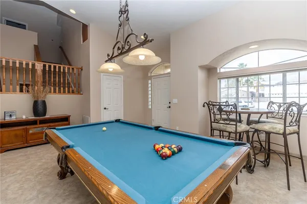 a living room with furniture a table and chairs