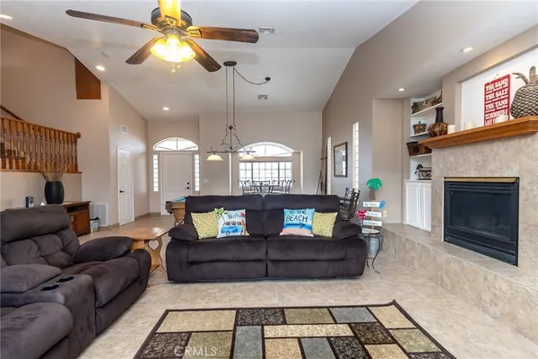 a kitchen with stainless steel appliances granite countertop a refrigerator a stove and a sink