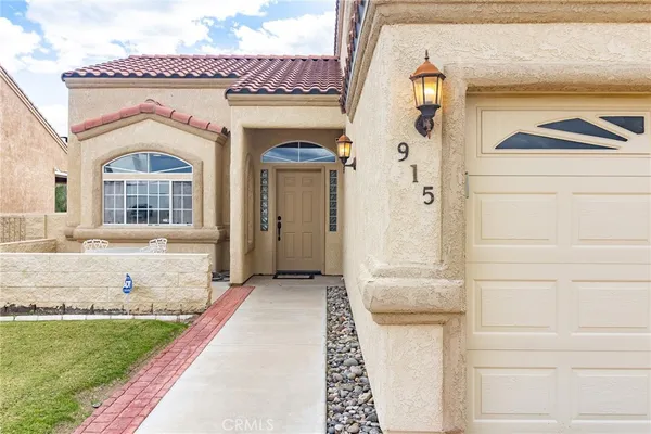 a room with furniture pool table flat screen tv and windows