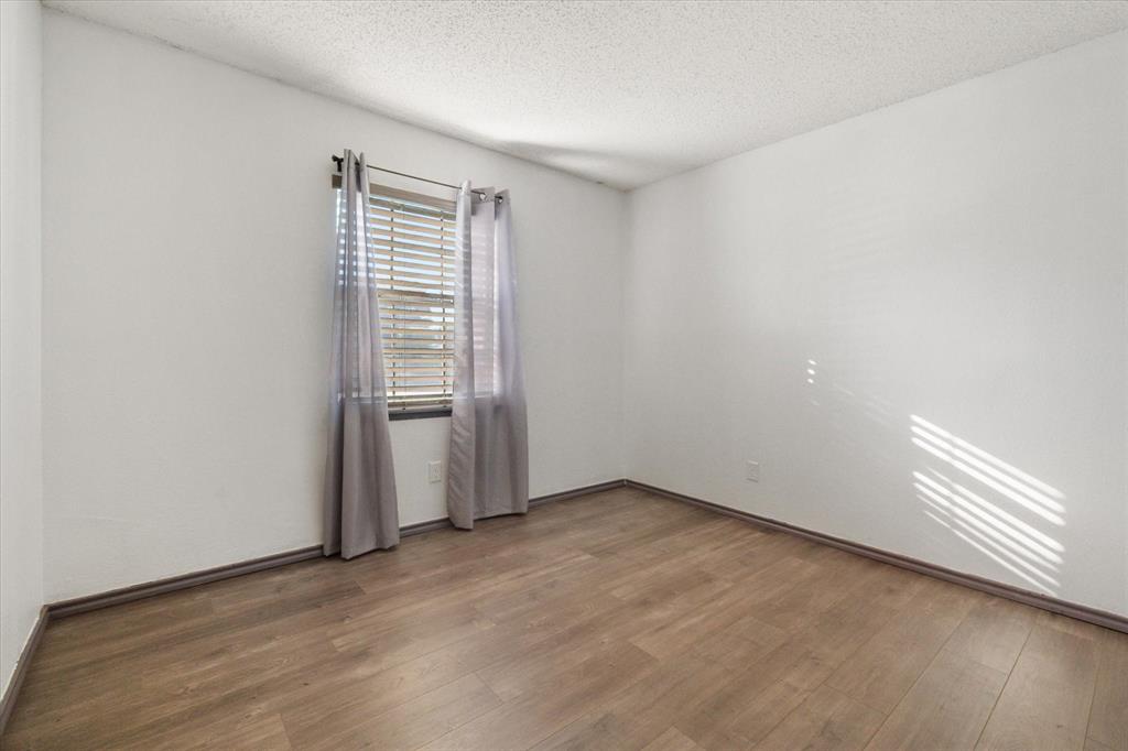 7308 Red Osier Road Dallas, TX 75249 - Photo 20 of 27 a view of an empty room with a window