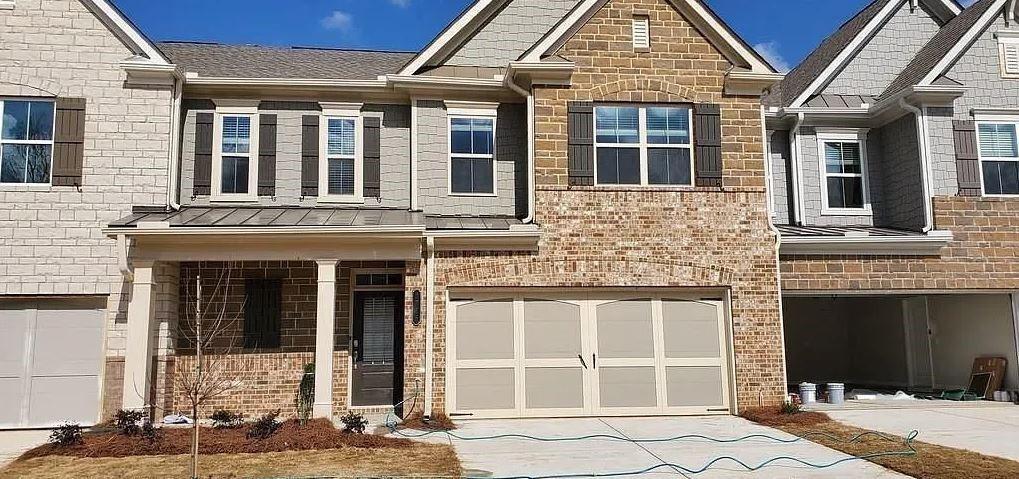 2945 Owlswick Way Cumming, GA 30040 - Photo 1 of 1 front view of a house with a large window