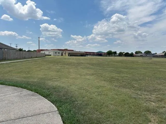 a view of a lake with a big yard