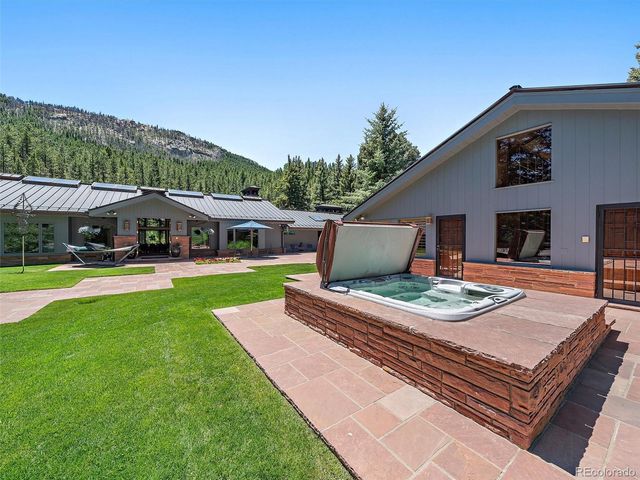 a view of house with swimming pool outdoor seating
