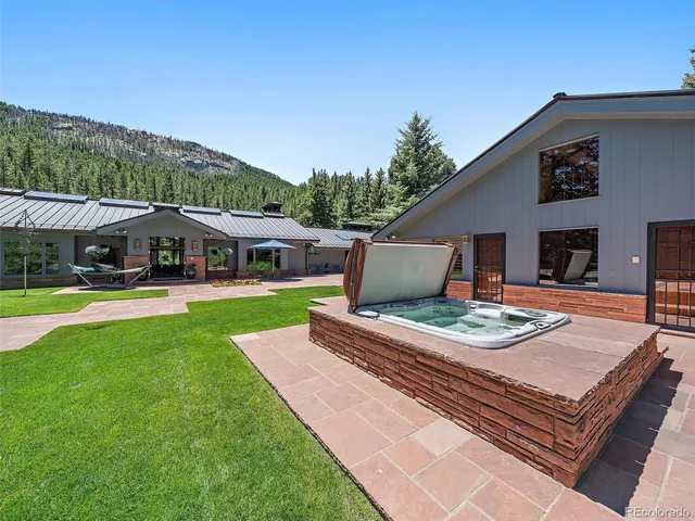 a view of house with swimming pool outdoor seating