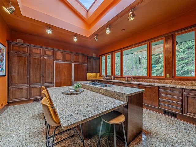 a kitchen with a table and chairs in it