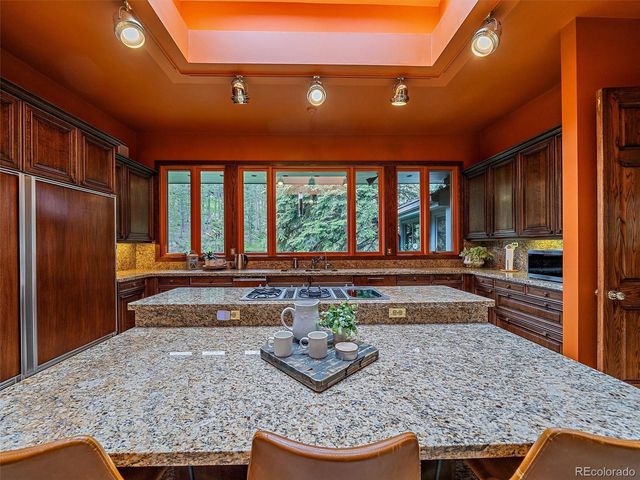 a room with lots of counter top space and furniture