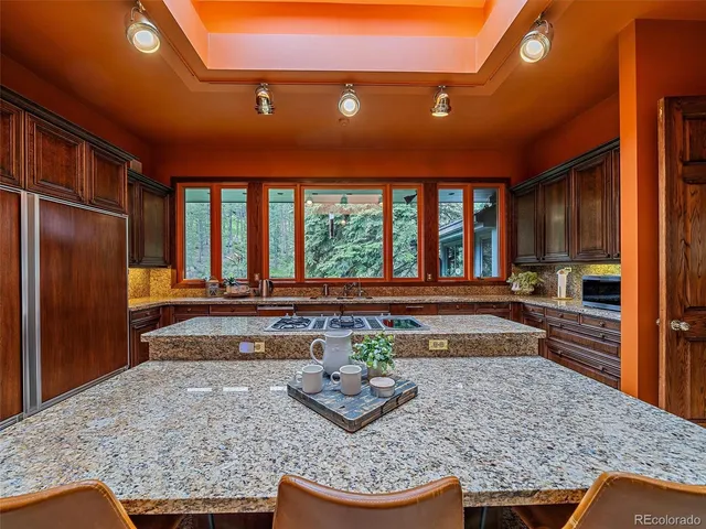 a room with lots of counter top space and furniture