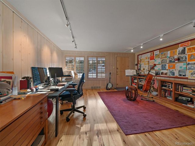 a workspace with furniture water view and a large window