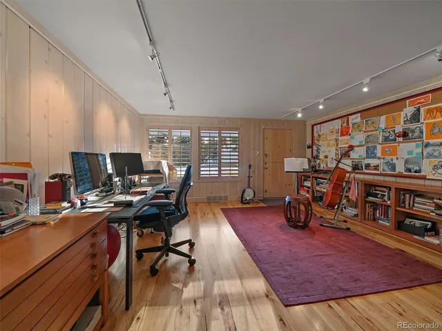 a workspace with furniture water view and a large window