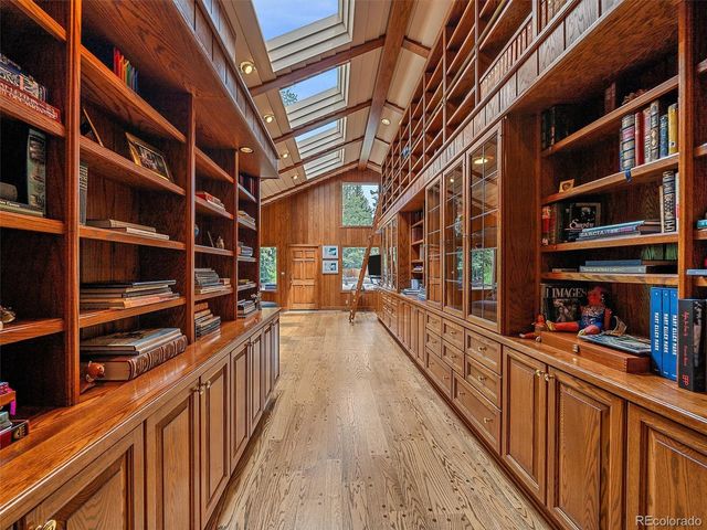 a view of a house with backyard porch and wooden floor