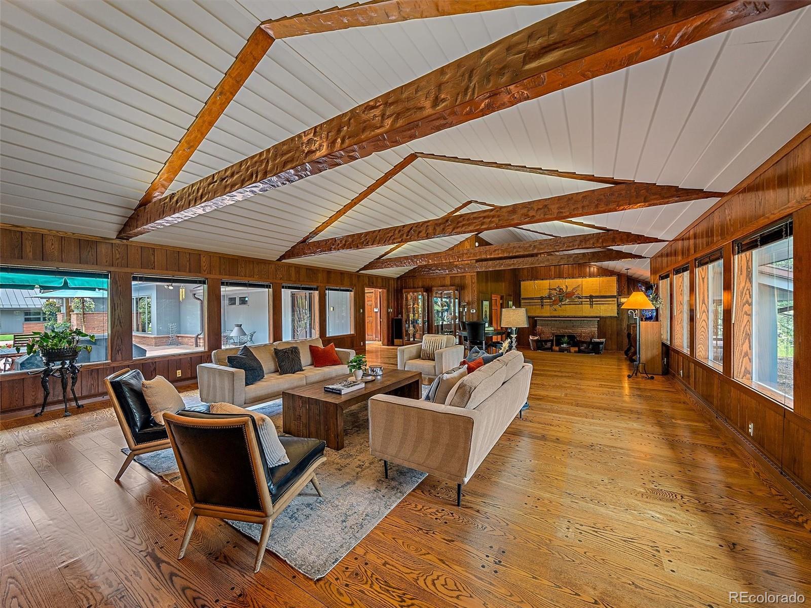 32453 Upper Bear Creek Road Evergreen, CO 80439 - Photo 4 of 48 a living room with furniture and a large window