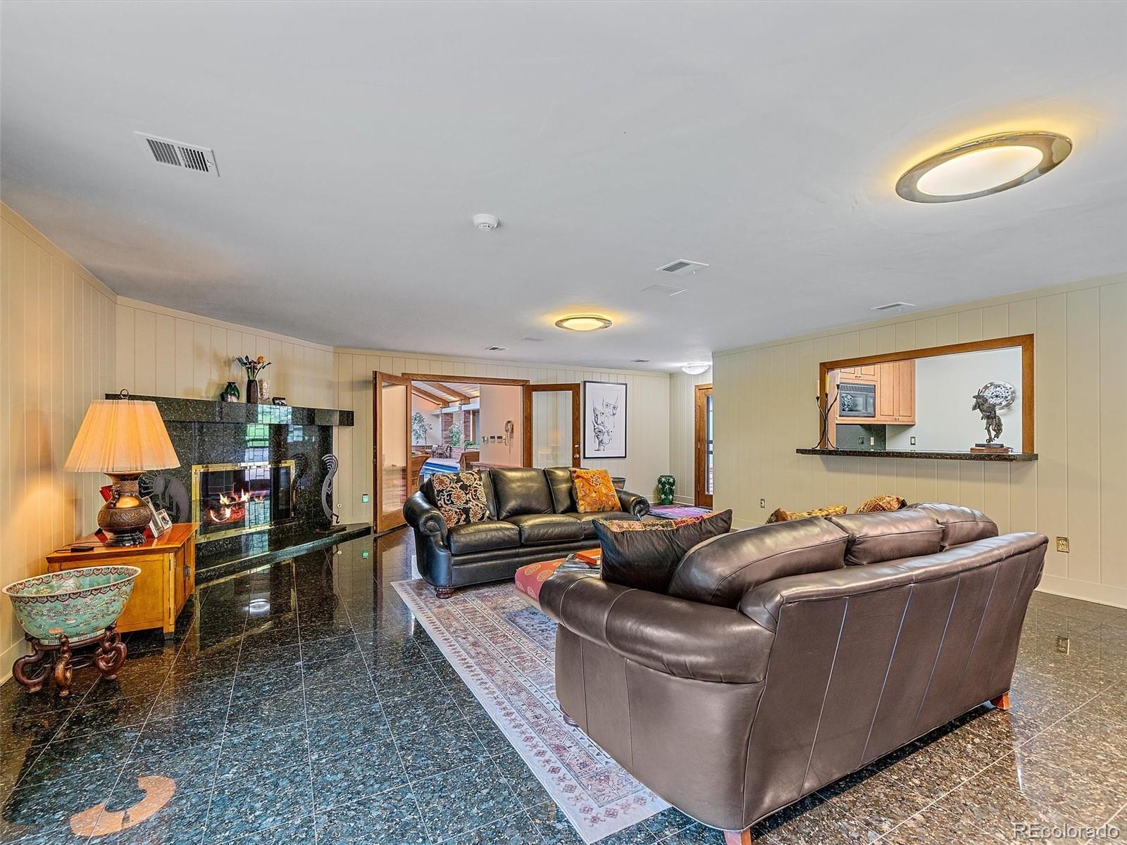 32453 Upper Bear Creek Road Evergreen, CO 80439 - Photo 45 of 48 a living room with furniture and a wooden floor