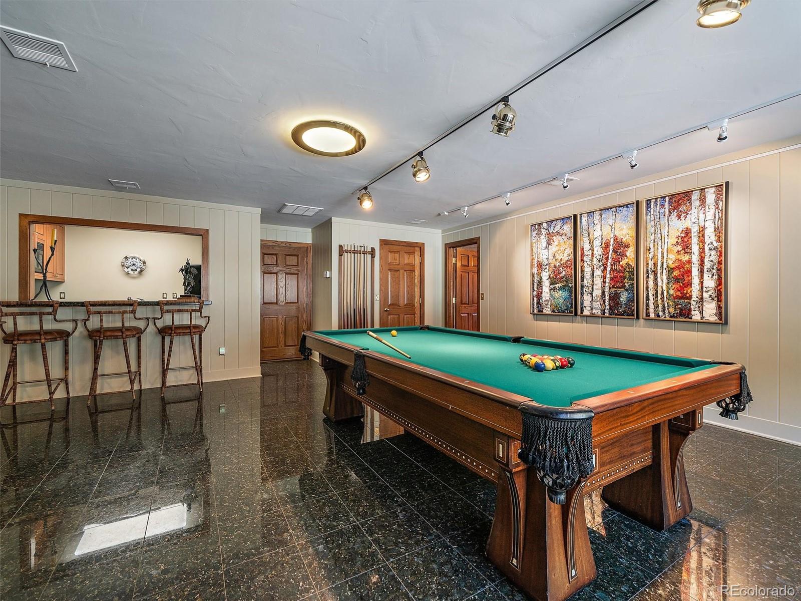 32453 Upper Bear Creek Road Evergreen, CO 80439 - Photo 46 of 48 a room with pool table and windows