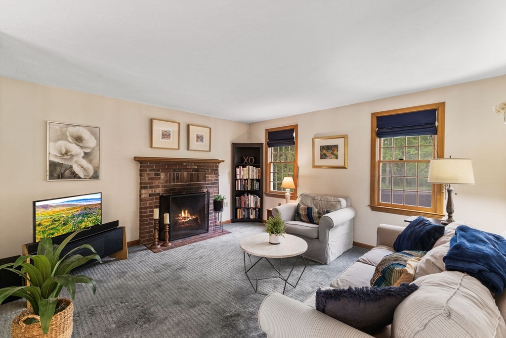 2 McTee Drive Norton, MA 02766 - Photo 12 of 42 a living room with furniture potted plant and a fireplace