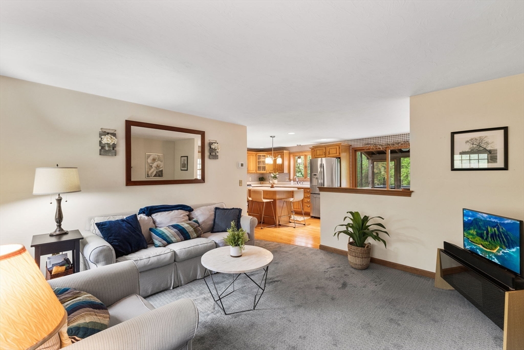 2 McTee Drive Norton, MA 02766 - Photo 13 of 42 a living room with furniture and a flat screen tv