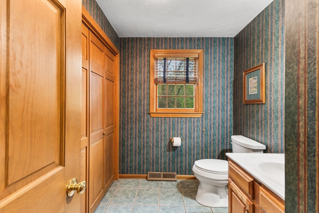 2 McTee Drive Norton, MA 02766 - Photo 16 of 42 a bathroom with a toilet a sink and shower