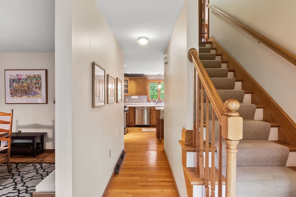 2 McTee Drive Norton, MA 02766 - Photo 21 of 42 a view of a hallway with wooden floor and staircase