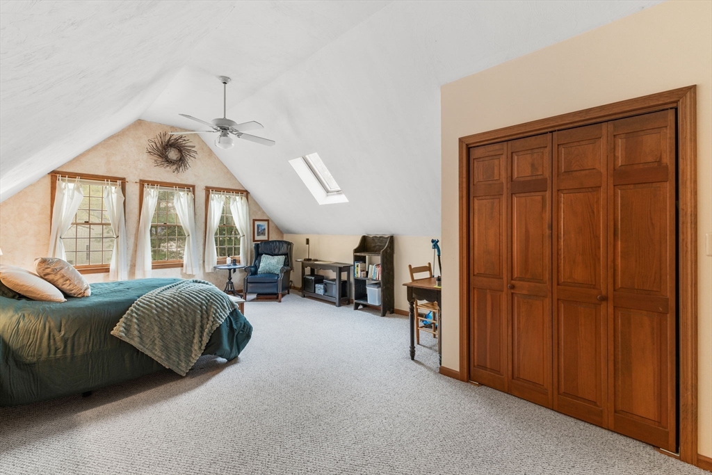 2 McTee Drive Norton, MA 02766 - Photo 23 of 42 a living room with furniture and large windows