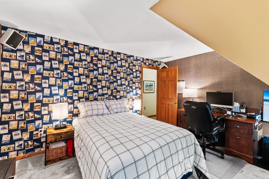 2 McTee Drive Norton, MA 02766 - Photo 29 of 42 a bedroom with a bed and wooden floor