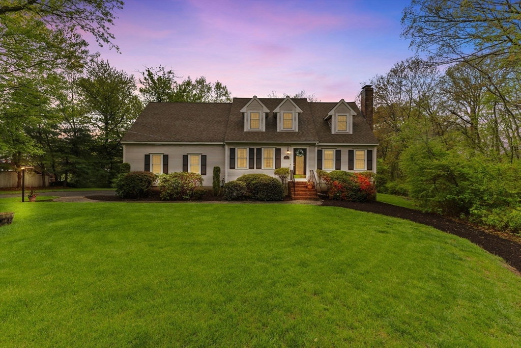 2 McTee Drive Norton, MA 02766 - Photo 3 of 42 a front view of a house with a yard and trees