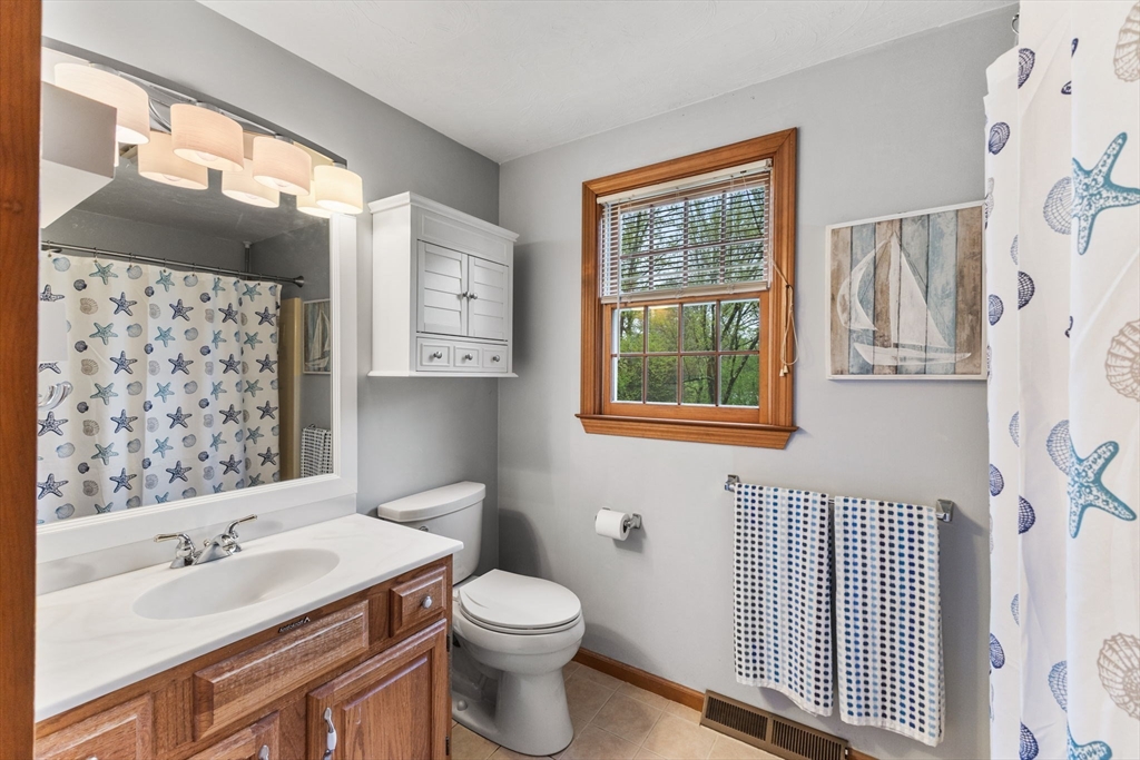 2 McTee Drive Norton, MA 02766 - Photo 31 of 42 a bathroom with a sink toilet and window