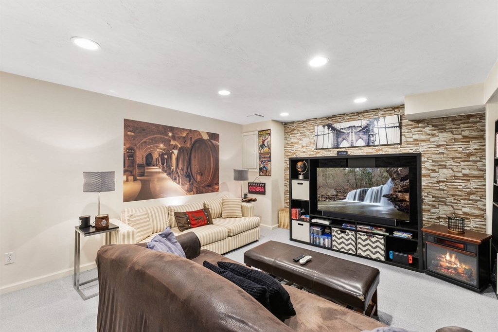 2 McTee Drive Norton, MA 02766 - Photo 34 of 42 a living room with furniture and a flat screen tv