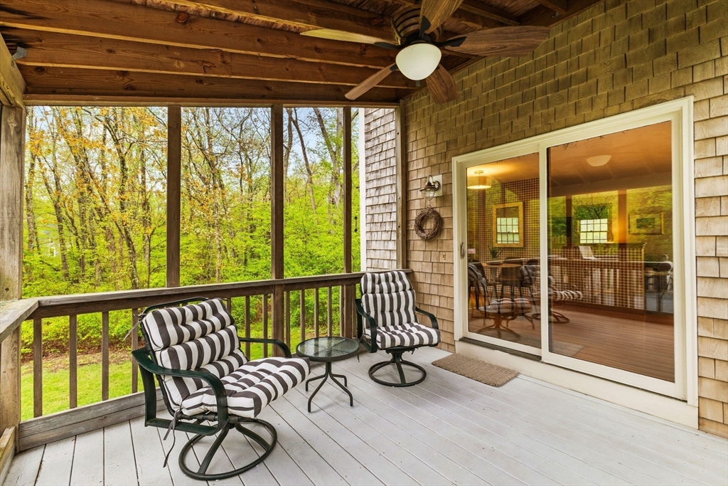 2 McTee Drive Norton, MA 02766 - Photo 37 of 42 a view of a porch with furniture and wooden floor