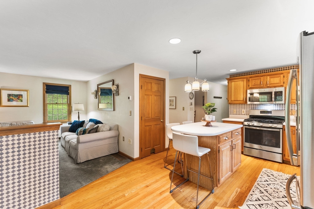 2 McTee Drive Norton, MA 02766 - Photo 7 of 42 a living room with furniture flat screen tv and window