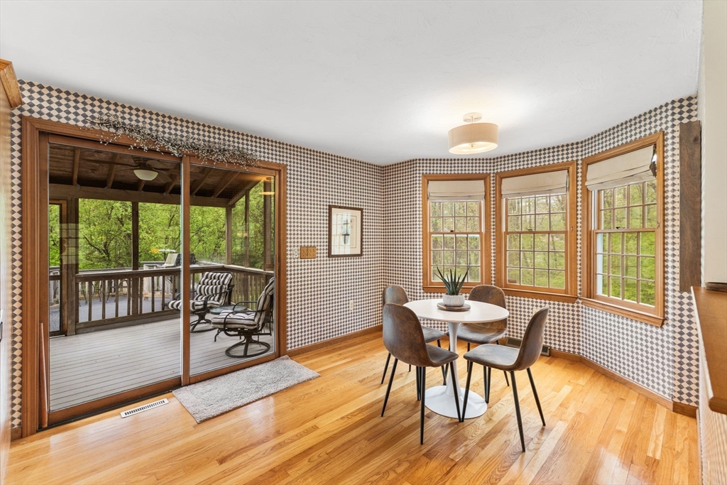 2 McTee Drive Norton, MA 02766 - Photo 8 of 42 a dining room with furniture a chandelier and wooden floor