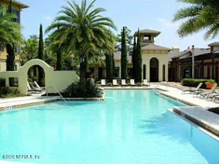 a swimming pool with outdoor seating and yard