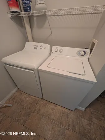 a utility room with dryer and washer