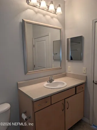 a bathroom with a toilet and shower