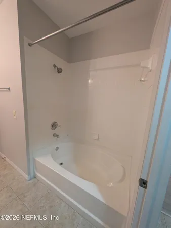 a close up of a bathtub in a bathroom