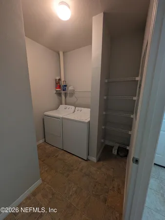 a utility room with dryer and washer