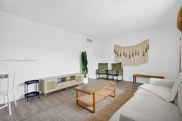 a bedroom with a bed and a night stand