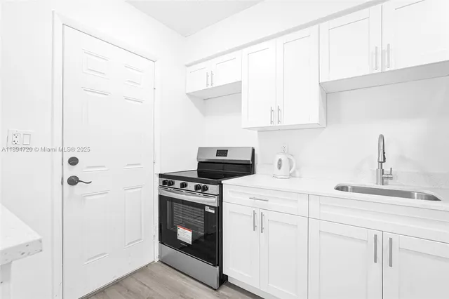 a kitchen with a stove and a microwave