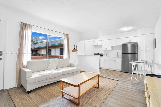 a living room with furniture and a table