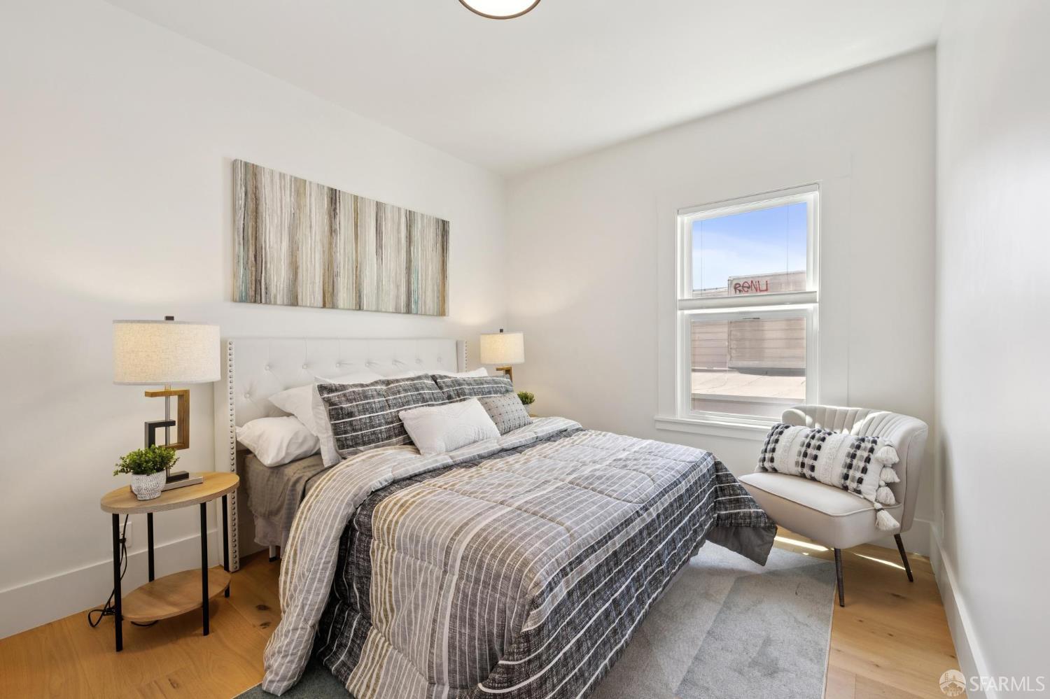 31 Romolo Place, Unit 4 San Francisco, CA 94133 - Photo 7 of 23 a bedroom with a bed and a window