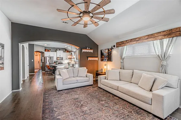 a living room with furniture and a rug